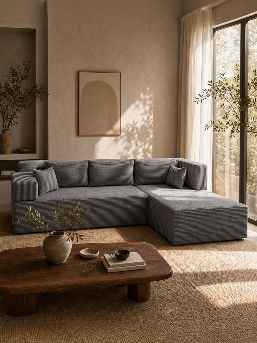 Grey corduroy Monvane modular sofa with a chaise in a sunlit living room