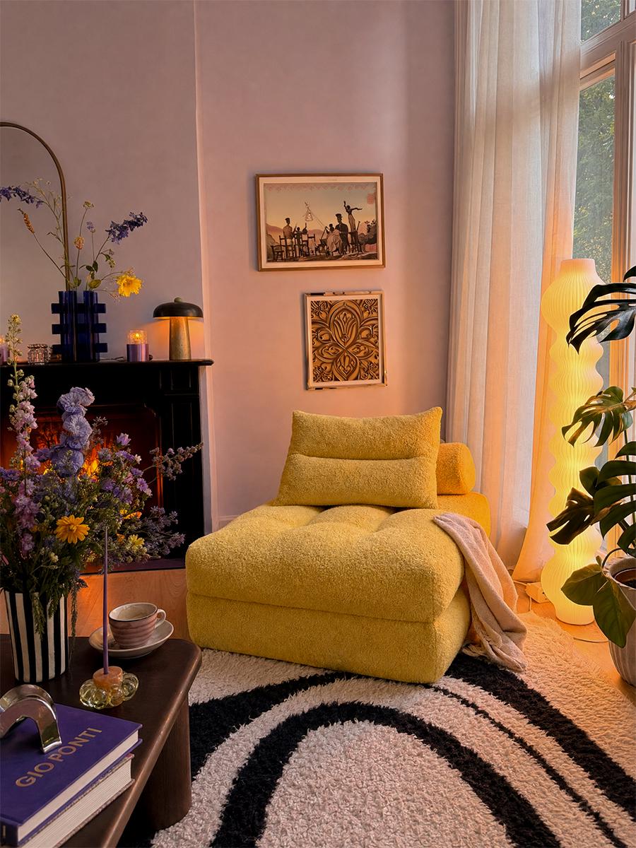 Yellow Monvane boneless lounger folded as an armchair in a bright corner